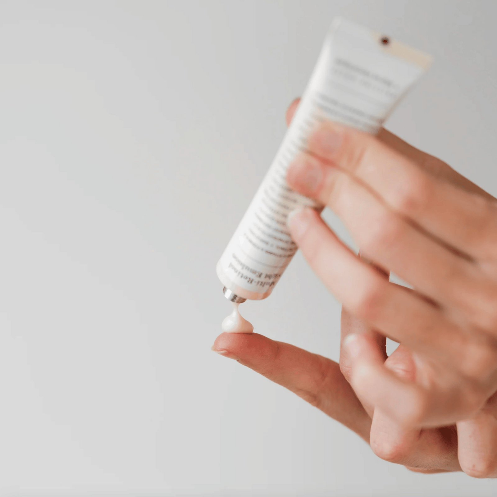 Woman using some of the Marie Veronique Multi Retinol Night Emulsion