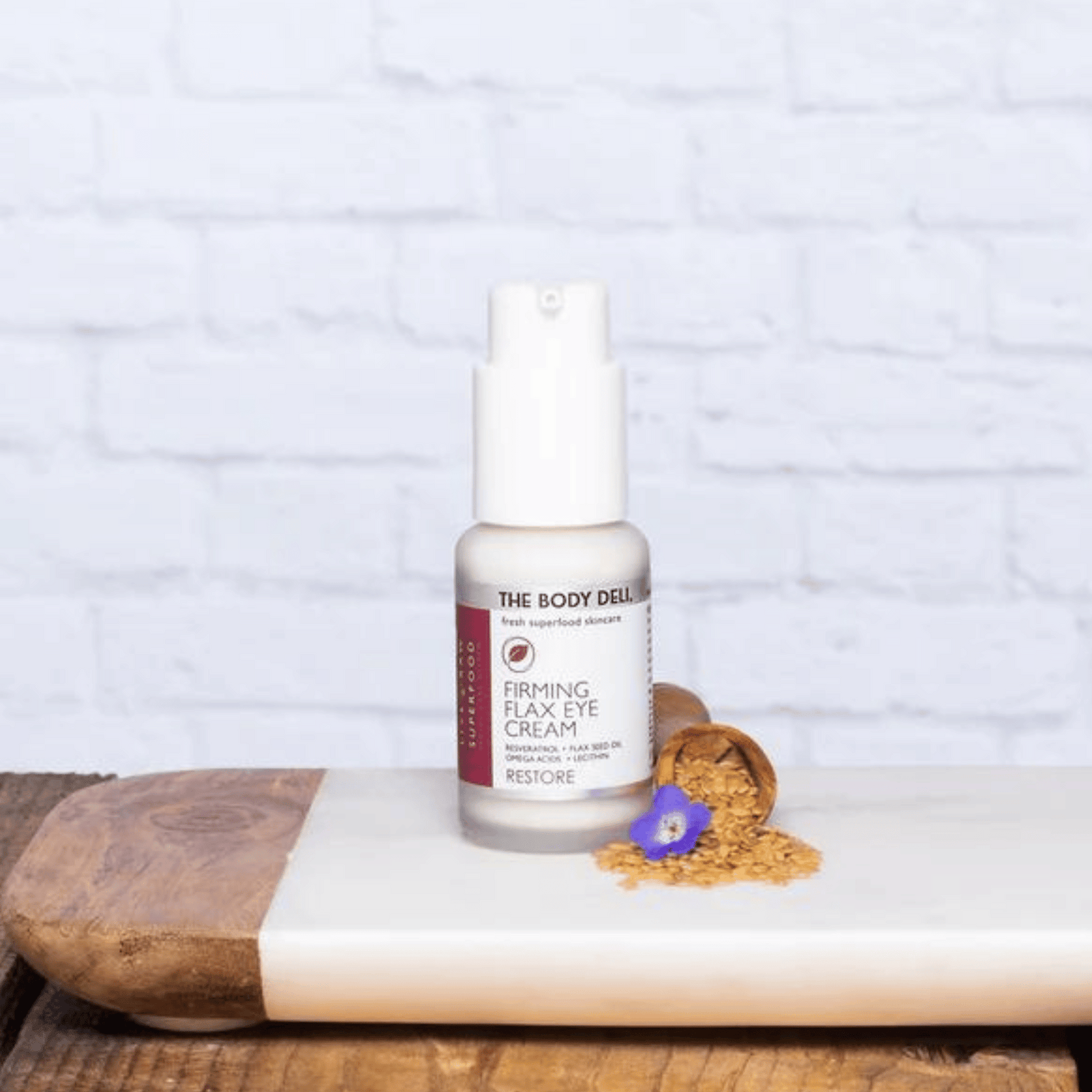 Eye Cream on tray with flax seeds