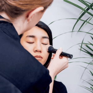 women getting makeup on