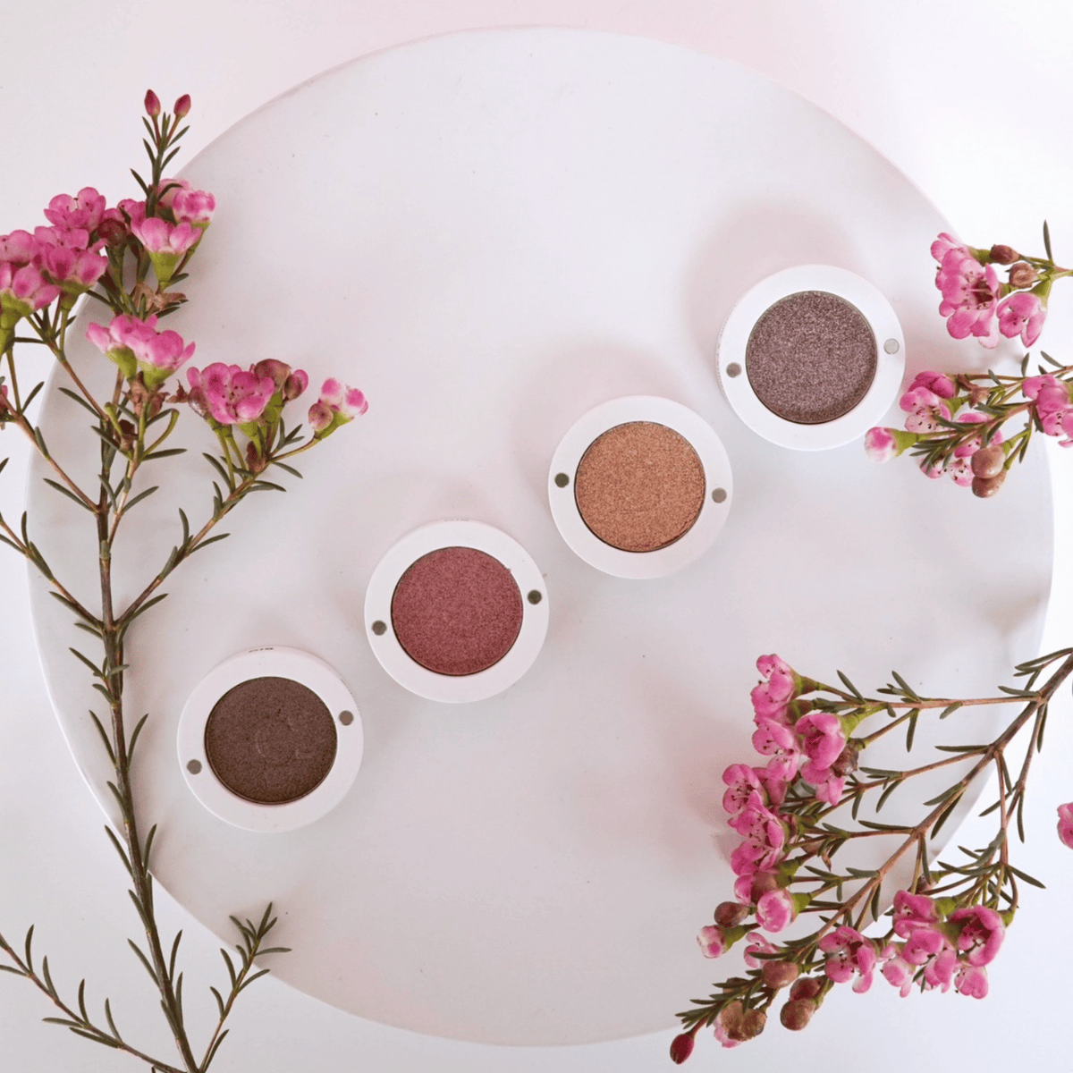 eyeshadows on tray with flowers