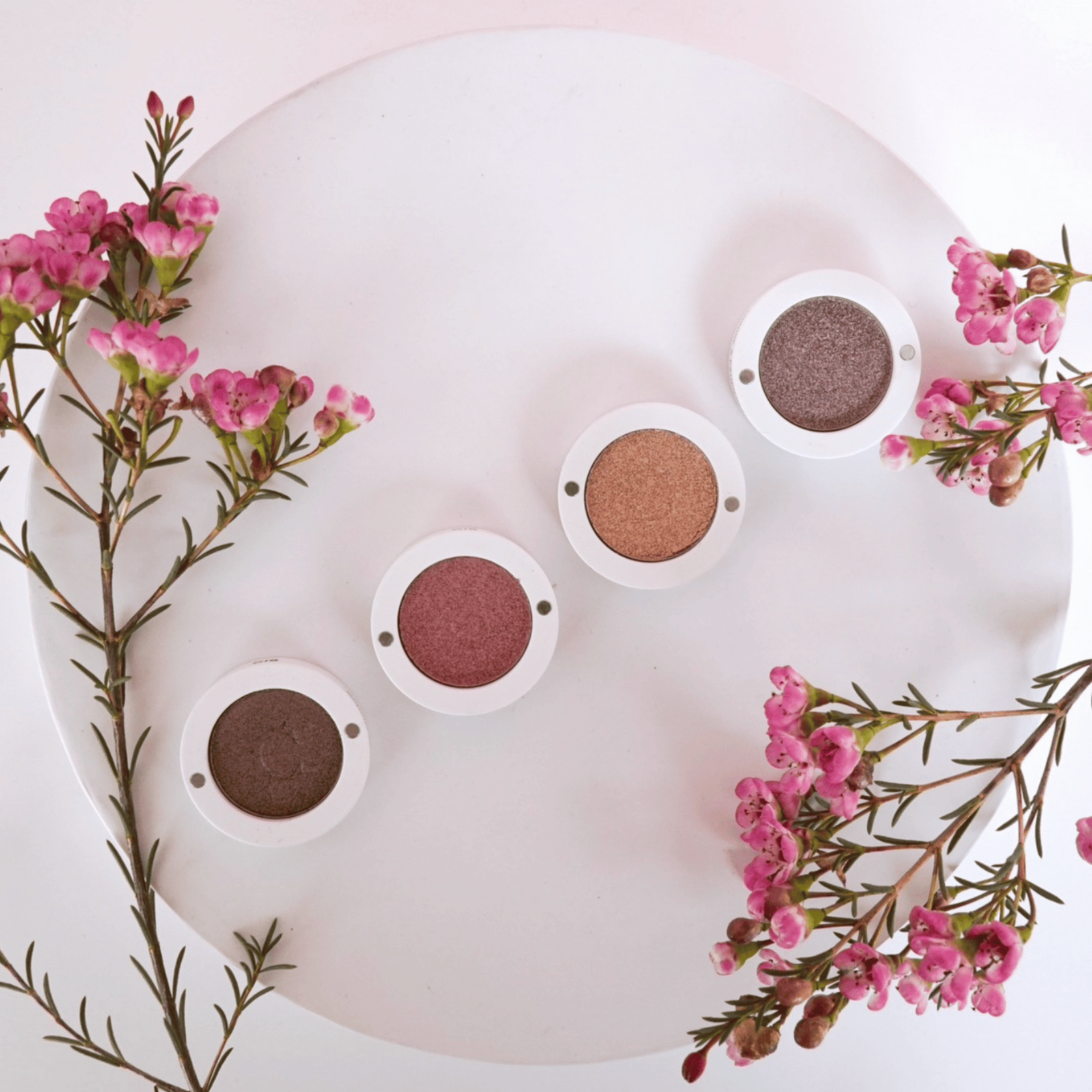 eyeshadows on tray with flowers