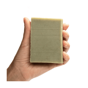 ground soap with bar on hand