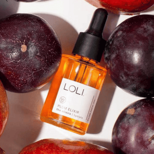loli plum elixir surrounded by plum fruit