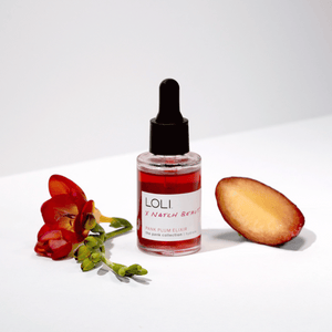 loli plum facial oil with flower and plum fruit