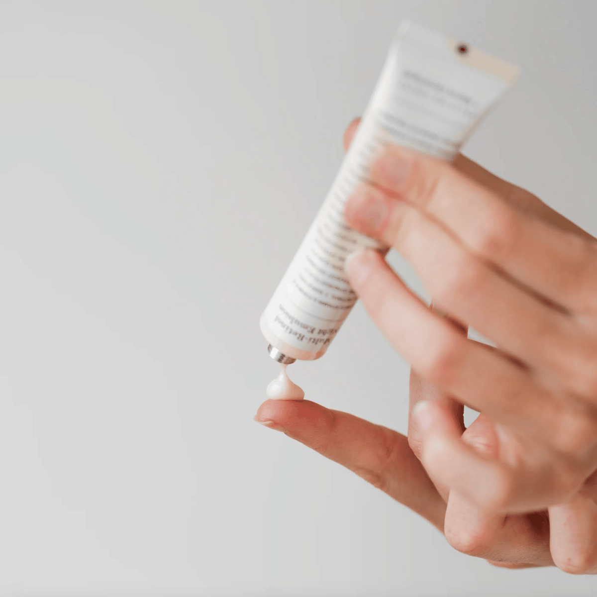 Woman using some of the Marie Veronique Multi Retinol Night Emulsion