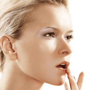 women applying lip gloss
