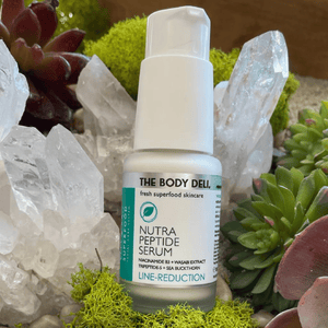 body deli peptide serum with crystals and aloe plants