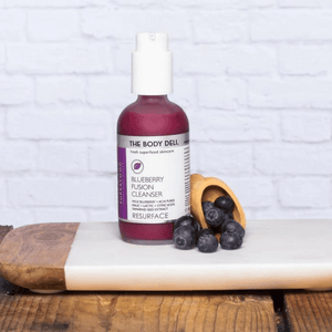 Body Deli Cleanser with blueberries on tray