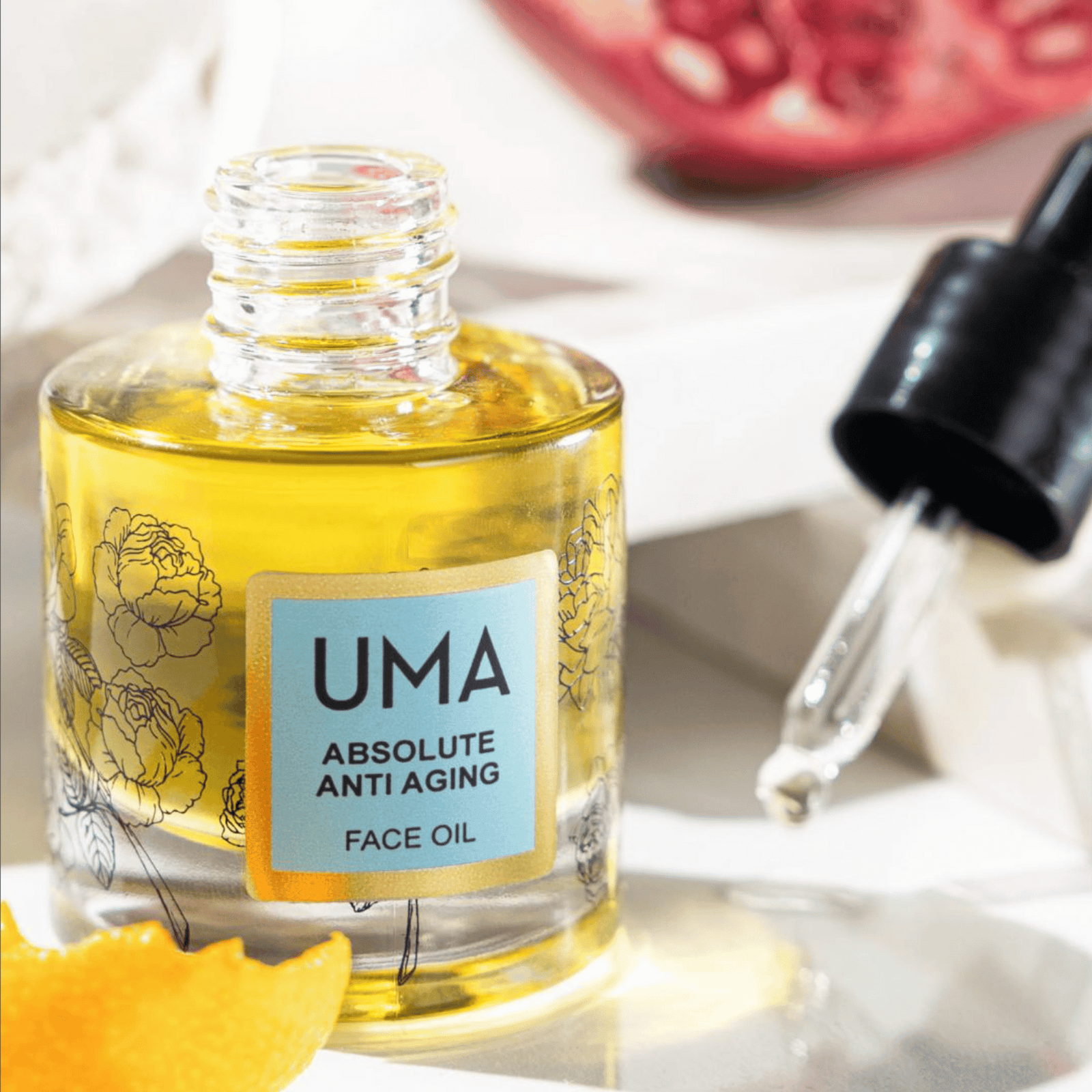 uma anti-aging facial oil photo with oranges