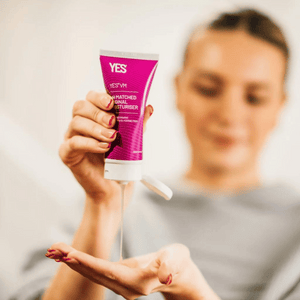 Women pouring some Yes VM lubricant into her hand.